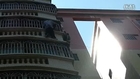 Police officer risks life to rescue boy hanging off balcony